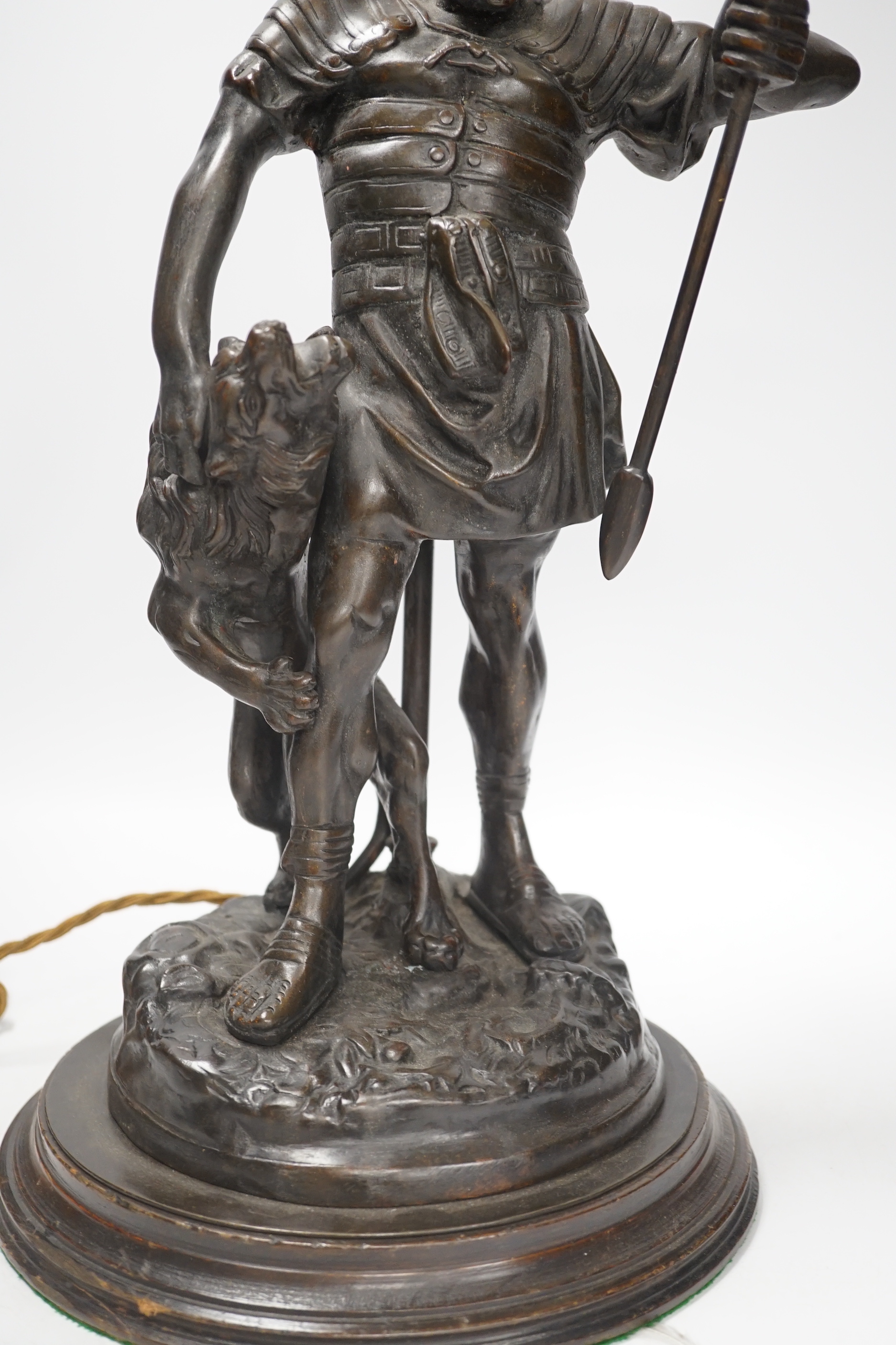 A bronze Roman soldier and lion table lamp, 60cm high including light fitting